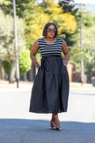 Sleeveless striped midi dress with navy-and-white bodice and gathered dark skirt