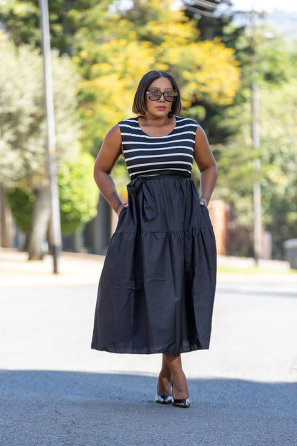 Sleeveless striped midi dress with navy-and-white bodice and gathered dark skirt
