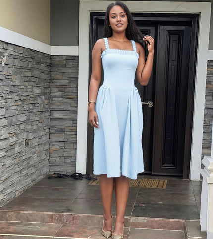 White pleated maxi dress with square neckline and gathered straps