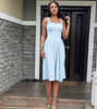 White pleated maxi dress with square neckline and gathered straps
