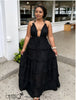 Black tiered ruffle maxi dress with deep V halter neckline