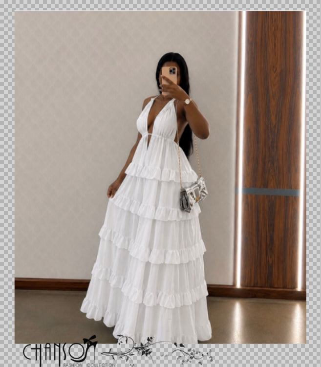 White tiered ruffle maxi dress with deep V halter straps and ruffle skirt