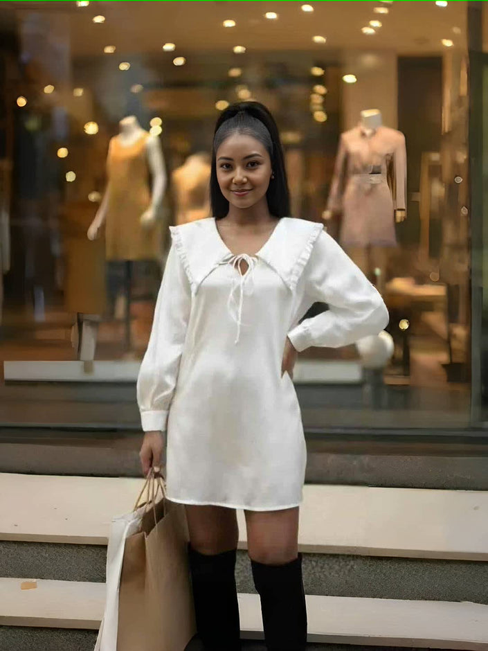 White ruffle-collar mini dress with tie neck and puff sleeves, long cuffs