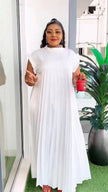 White pleated maxi dress with high neck and layered, swaying skirt