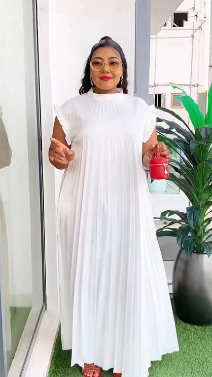 White pleated maxi dress with high neck and layered, swaying skirt