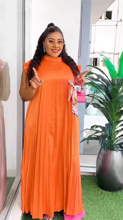 Orange-red pleated maxi dress with gathered neckline and flowing skirt