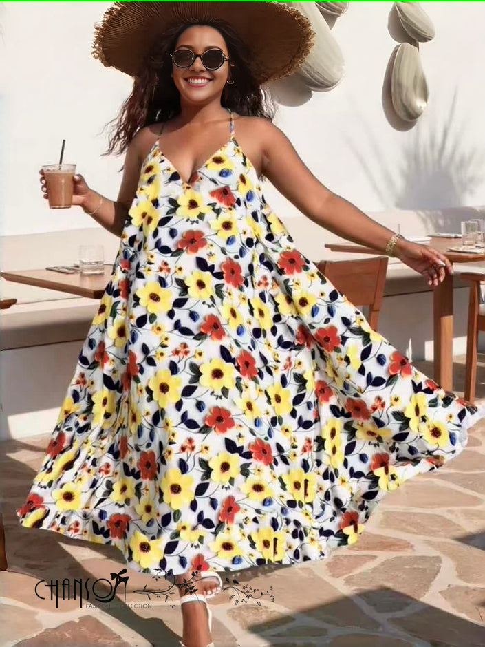 Floral maxi dress with spaghetti straps, flowing white fabric with yellow and red flowers