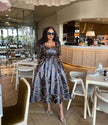 Geometric midi dress with waist tie, dark with white swirl pattern, long sleeves