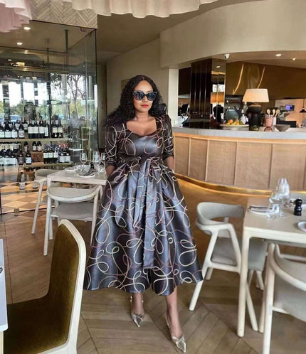 Geometric midi dress with waist tie, dark with white swirl pattern, long sleeves