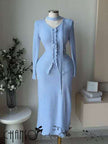 Blue knit twin set with long-sleeve cardigan and fitted maxi skirt with ruffle trim
