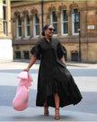 Black midi shirt dress with puff sleeves and tiered ruffle skirt