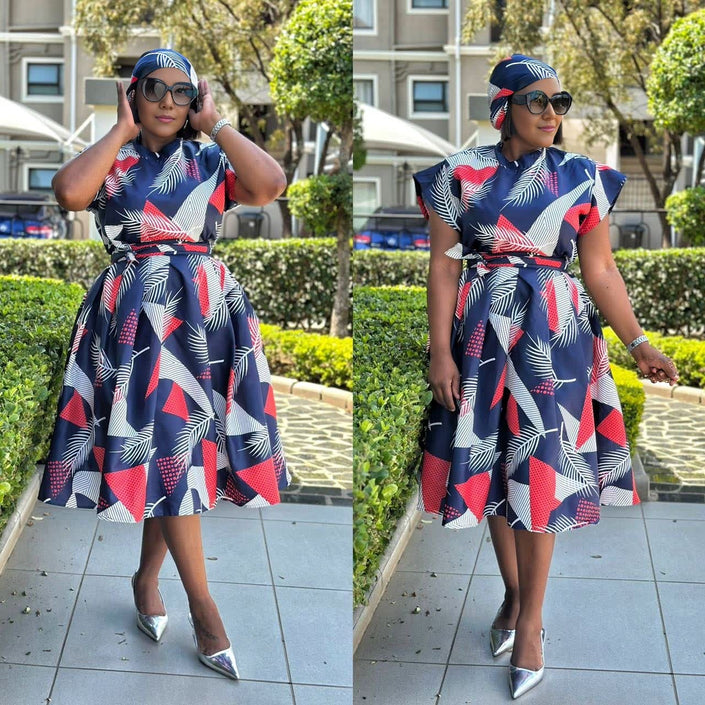 Geometric leaf midi dress with adjustable belt, navy blue with red and white leaf print