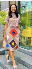 Tan midi skirt with geometric diamond print and button-front, colorful square accents