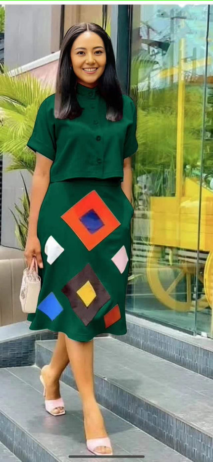 Dark-green midi skirt with geometric diamond print and button-front, bright square panels