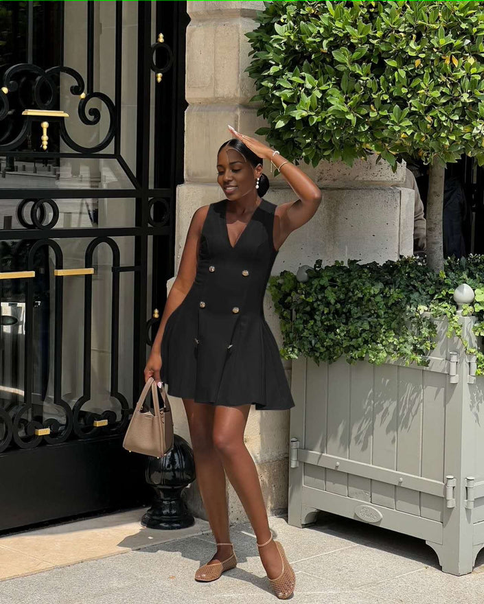 Black sleeveless V-neck blazer mini dress with gold buttons, flared skirt and fitted waist.