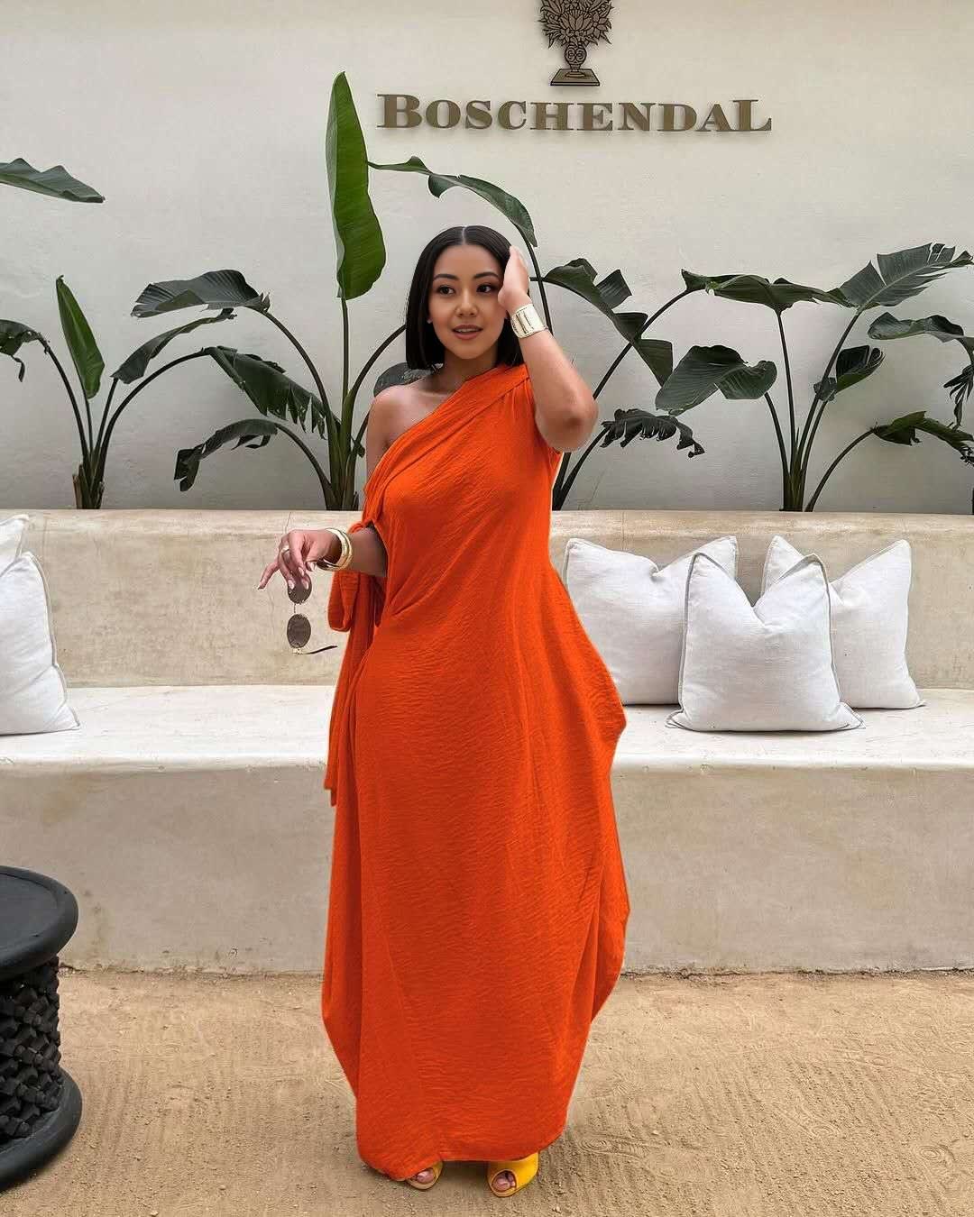 Orange-red one-shoulder maxi dress, layered loose fit with draped skirt