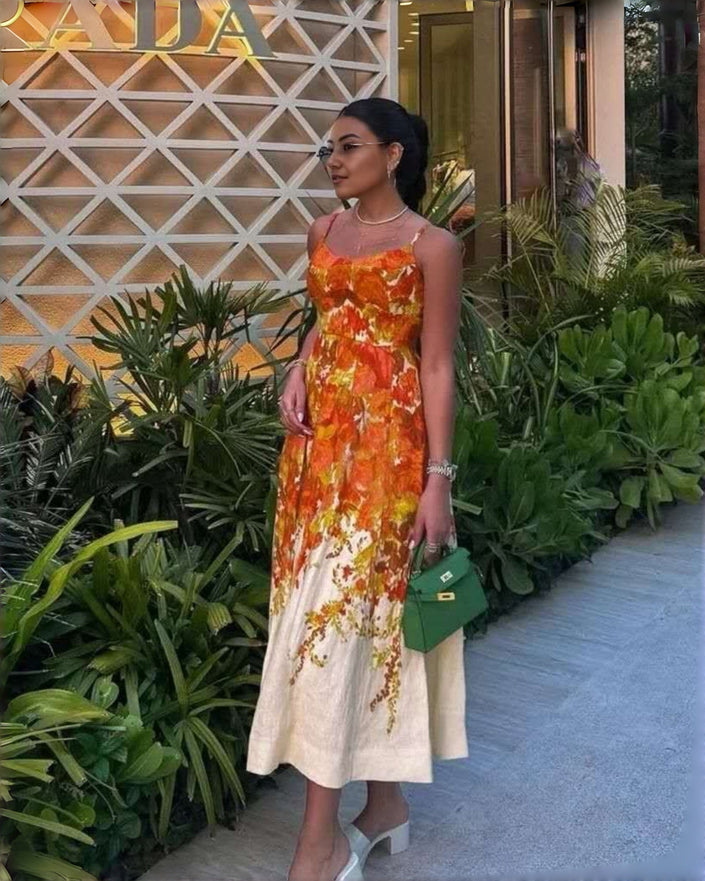 Sleeveless floral maxi dress with gathered waist, orange and white with V-neck