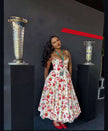 Floral A-line midi dress with spaghetti straps, white base and red green flower print