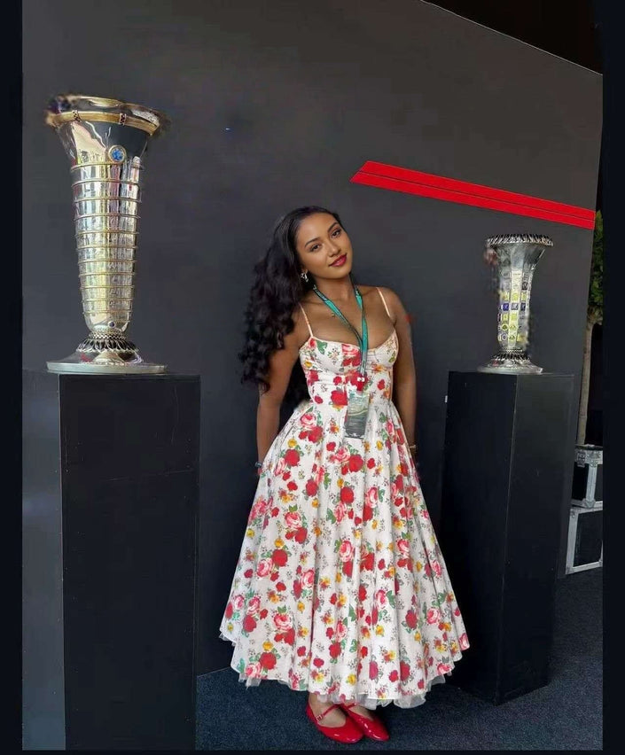 Floral A-line midi dress with spaghetti straps, white base and red green flower print