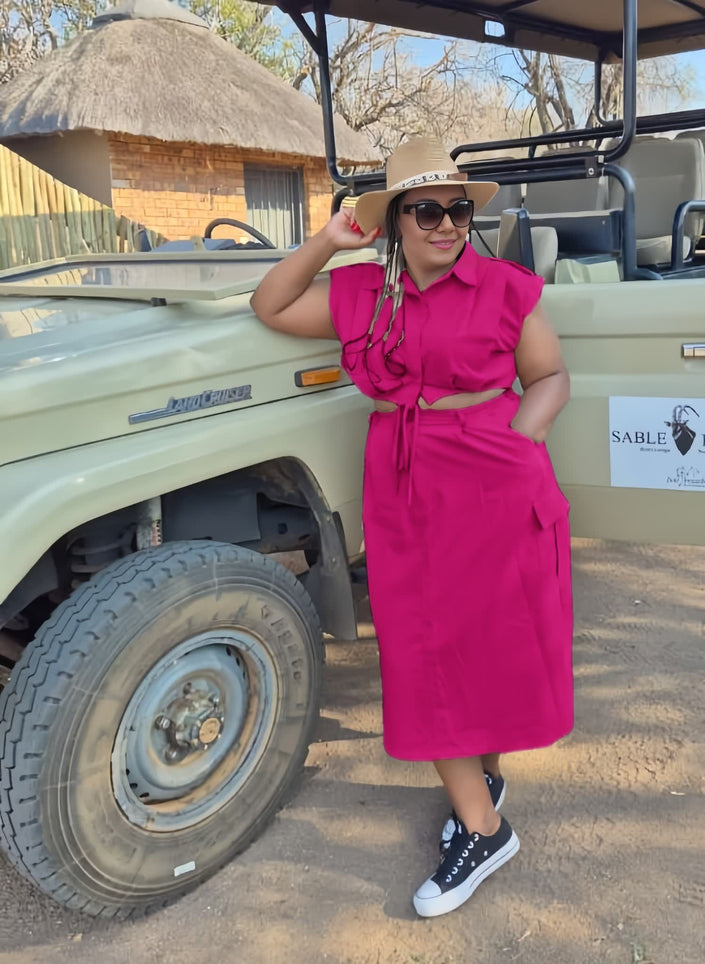 Deep-pink midi dress with front waist tie, sleeveless, gathered at waist.