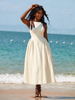 Beige midi dress with bow-tie adjustable straps, sleeveless fitted bodice and flared skirt