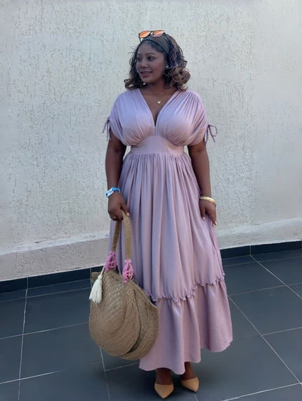 Light pink maxi dress with gathered waist and tiered ruffle hem