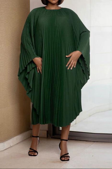 Pleated midi dress in dark green with high neckline and long flared sleeves.