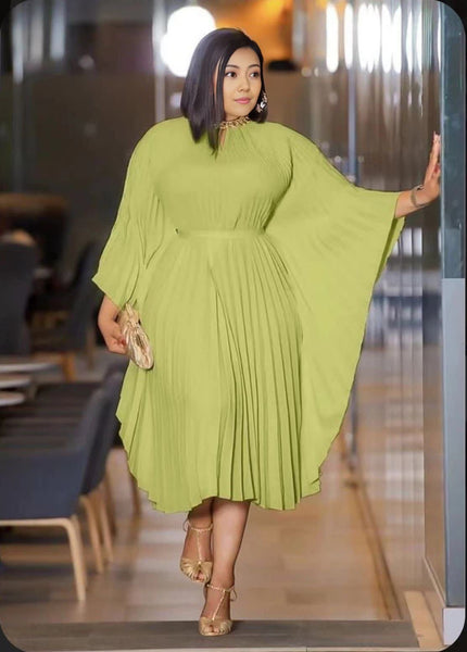 Pleated midi dress in light green with gathered waist and long flared sleeves.