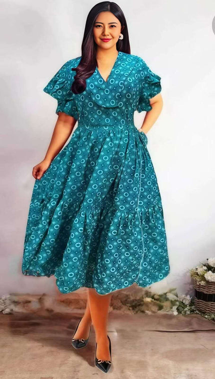 Teal printed midi dress with ruffle sleeves, V-neck, and gathered waist