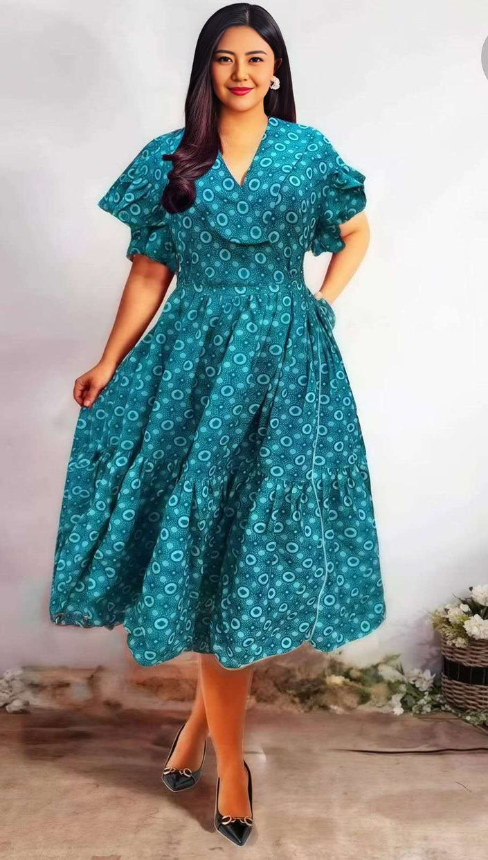 Teal printed midi dress with ruffle sleeves, V-neck, and gathered waist