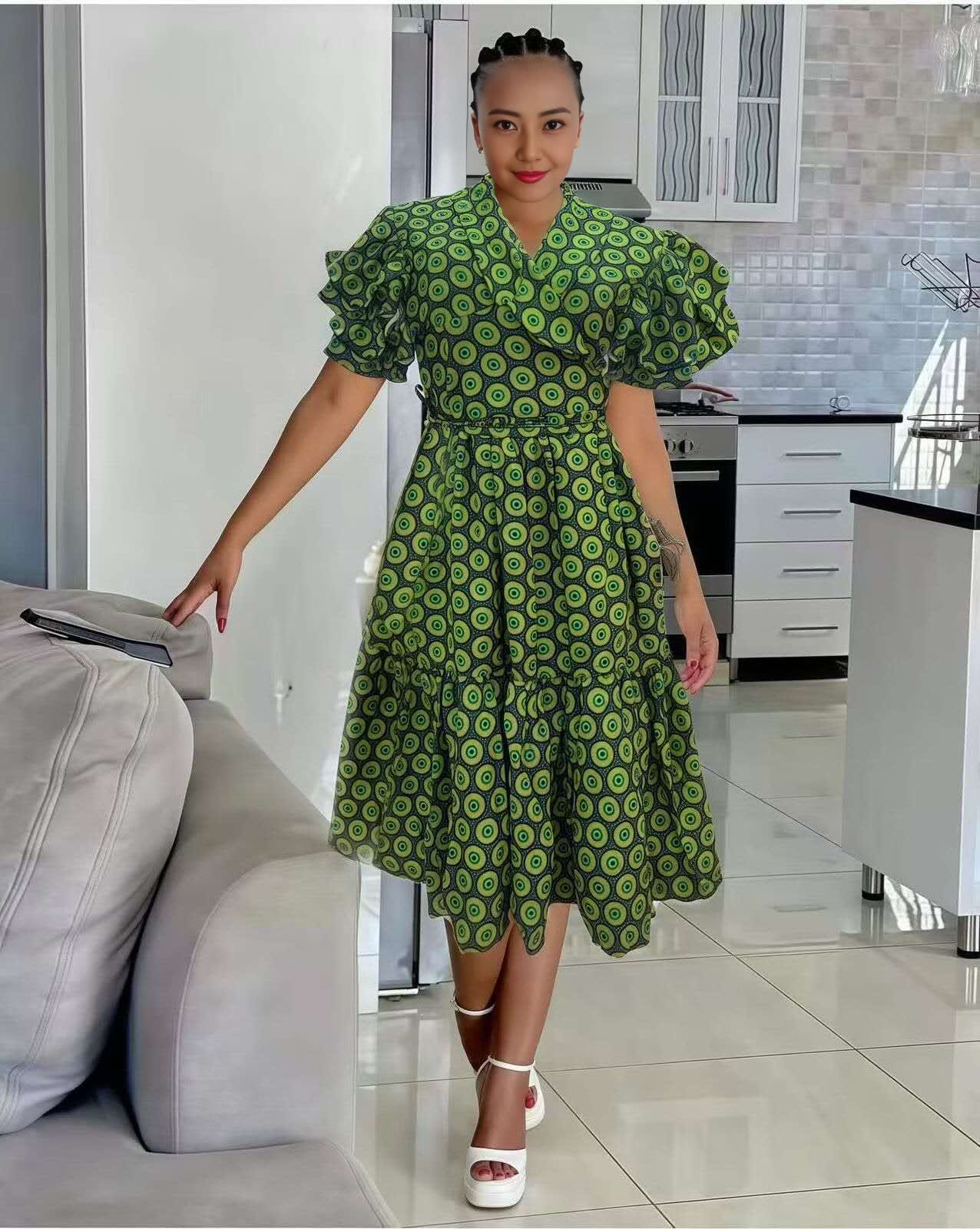 Green printed midi dress with ruffle sleeves V-neck and pleated skirt