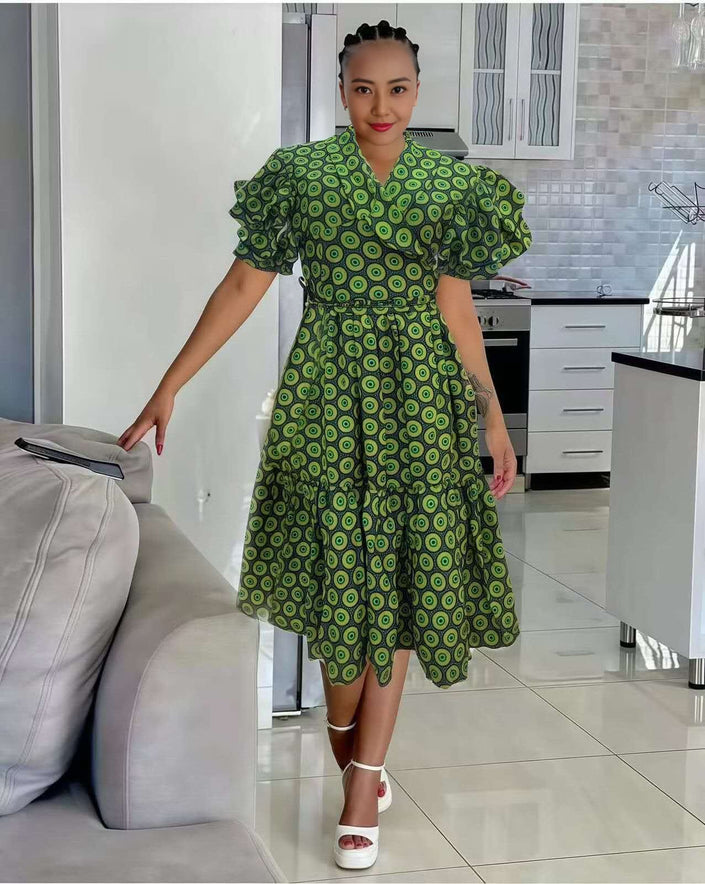 Green printed midi dress with ruffle sleeves V-neck and pleated skirt
