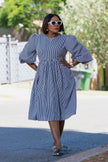 Blue striped puff-sleeve dress with gathered waist and full skirt, front view