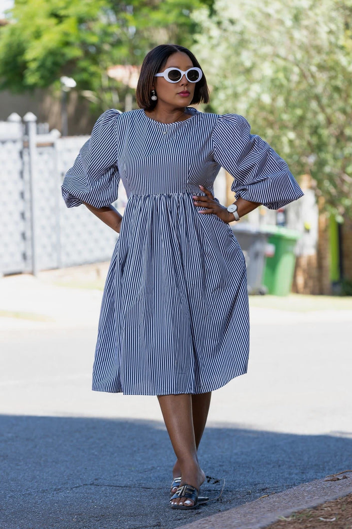 Blue striped puff-sleeve dress with gathered waist and full skirt, front view
