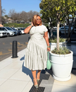 Beige tiered midi dress with short sleeves and ruching at the stretch waist