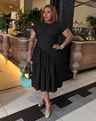 Black tiered midi dress with short sleeves and ruching at stretch waist