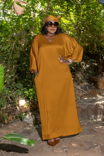 Mustard brown loose-fit maxi dress with V-neck and wide elbow-length sleeves