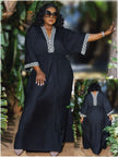 Black loose-fit maxi dress with embroidered V neckline and trim cuffs