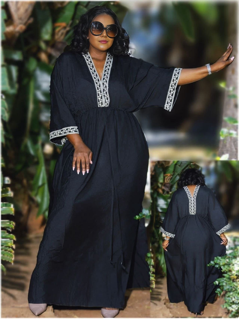 Black maxi dress with embroidered trim, V-neck and loose silhouette, three-quarter sleeves