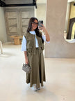Olive utility vest over white top with matching long maxi skirt