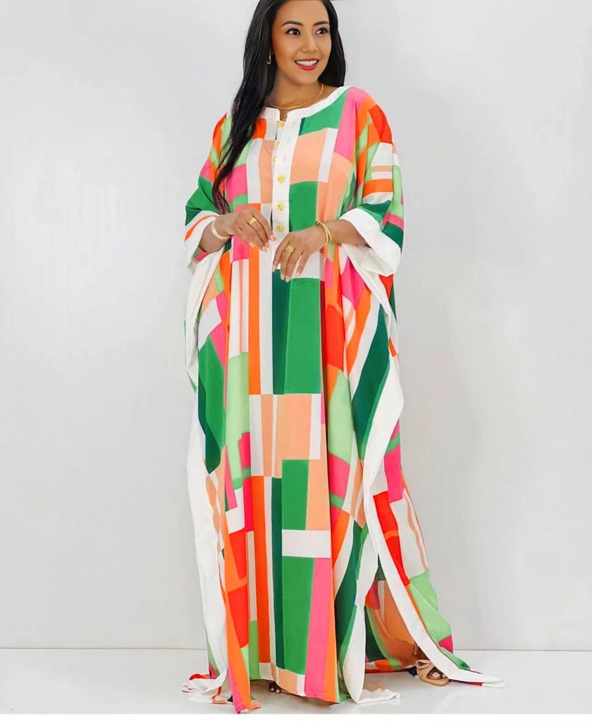 Plus size maxi dress with colorful geometric blocks, flowing draped sleeves