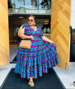 Plus size sleeveless maxi dress with geometric purple, pink, and blue pattern