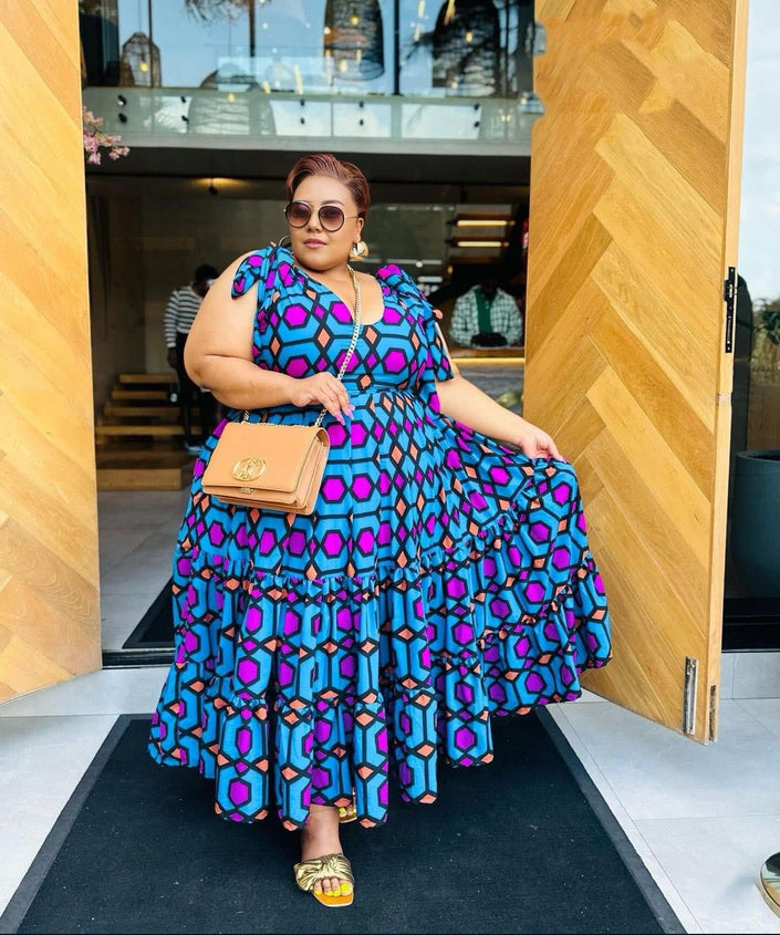 Plus size sleeveless maxi dress with geometric purple, pink, and blue pattern