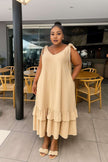 Beige tiered maxi dress with V-neck and tie shoulder straps