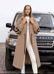 Nude hooded knit coat with front zipper, long length and geometric sleeve trim