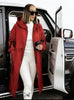 Red hooded knit coat with front zipper and geometric sleeve detailing, long length