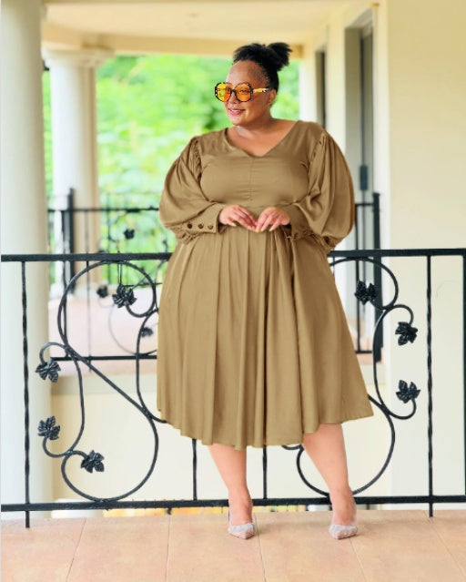 Plus-size midi dress in brown with puff sleeves and pleated skirt