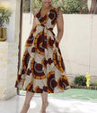 Sleeveless V-neck A-line midi dress with bold African print circles and blocks