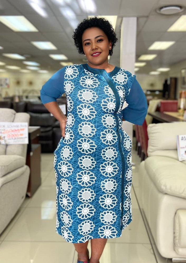 Plus-size floral midi dress, deep-sky-blue with white circular floral print, 3/4 sleeves