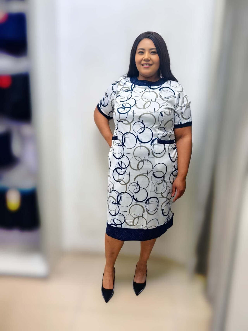 Midi dress with geometric circle print in navy on white, short sleeves, crew neck, side view.